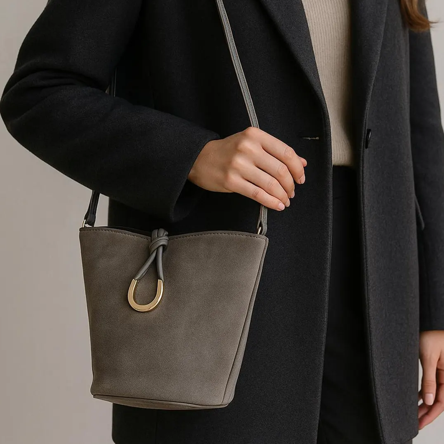 Ash Grey Matte Fuzzy Tapered Bucket Pouch With Golden U-Shaped Front Hardware, Curved Short Hand Grip And Detachable Slim Hanging Strip