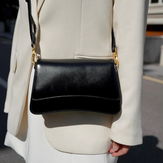 Glossy Black Curved Flap Slim Rectangular Shoulder Pouch With Golden Swivel Clasp Hardware And Single Wide Matching Hanging Strap