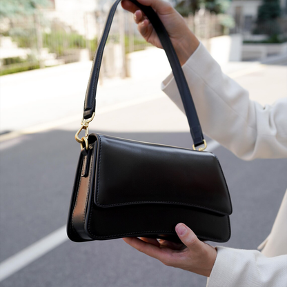 Glossy Black Curved Flap Slim Rectangular Shoulder Pouch With Golden Swivel Clasp Hardware And Single Wide Matching Hanging Strap